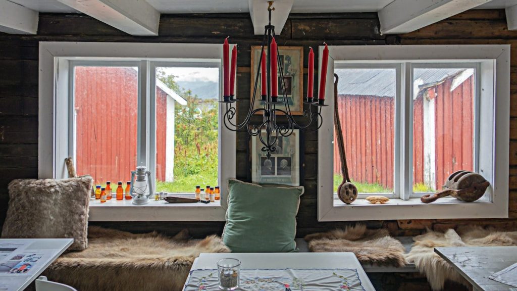 a living room filled with furniture and a window